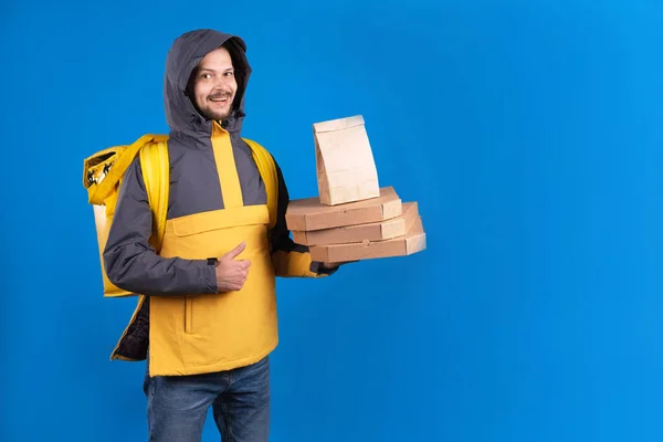 Unshaven Dark Haired Caucasian Courier Yellow Windbreaker Holds Order Pizza — Stock Photo, Image