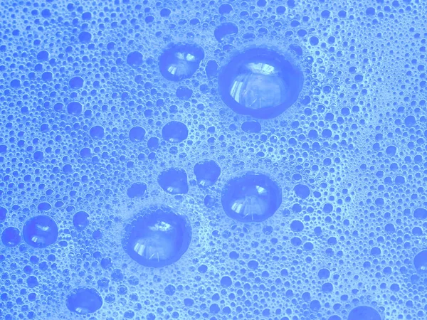 blue water with foam bubbles background, foam bubble dishwashing liquid