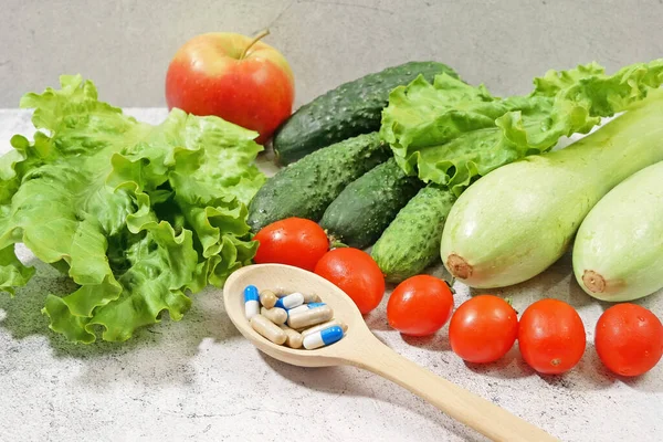 Healthy food vs pills. Salmon, vegetables and fruis vs medicine and drugs. Concept