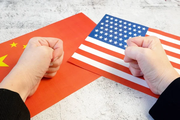 USA & China - disagreement, US of America and Chinese flags. Relationship conflict between USA and China. Trade deal concept