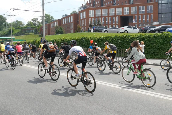 Bicycle racing wheels on cycle road race, Group of cyclist athletes riding fully speed