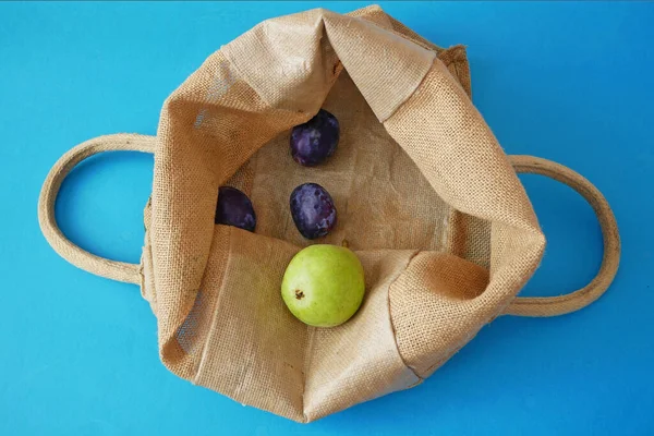 Organic Vegetables and fruits in cotton bag  with copy space, online market, green grocery delivery at home, zero waste concept
