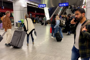 Vienna, Austria - August 3 2025: platform of railway train station and many people get on the elevator, indoors