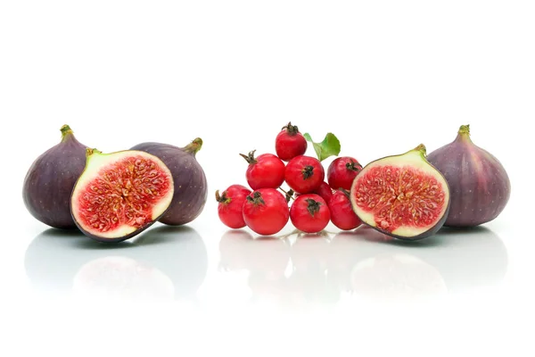 Ripe figs and apples on a white background with reflection. horizontal photo.