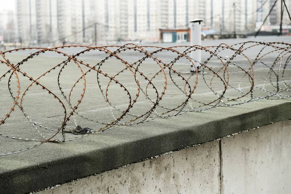 barbed wire on the roof of the plant