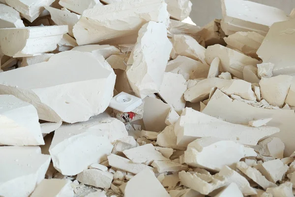 large pile of construction debris from foam blocks at the construction site