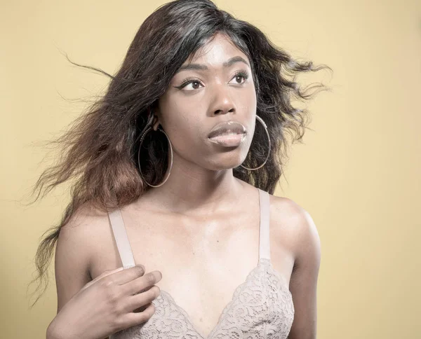 African American woman in bra on a seamless background — Stock Photo, Image