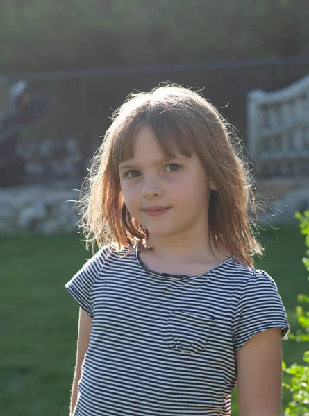 six year old girl backlit by sun