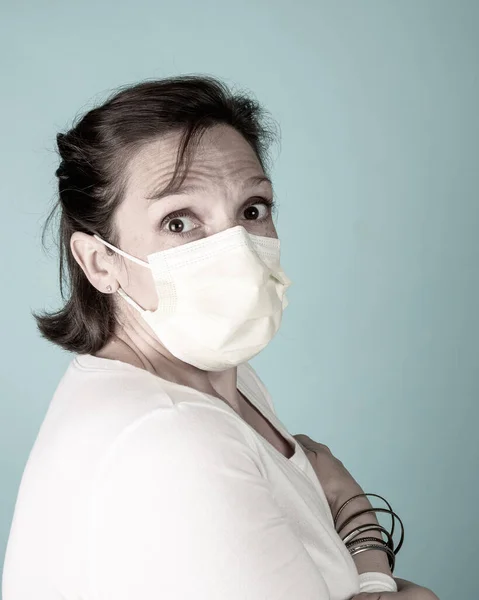 Scared Woman wearing a mask — Stock Photo, Image