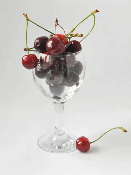 Ripe Cherries Filled Glass Transparent Glass Which Stands Isolated Background — Stock Photo, Image