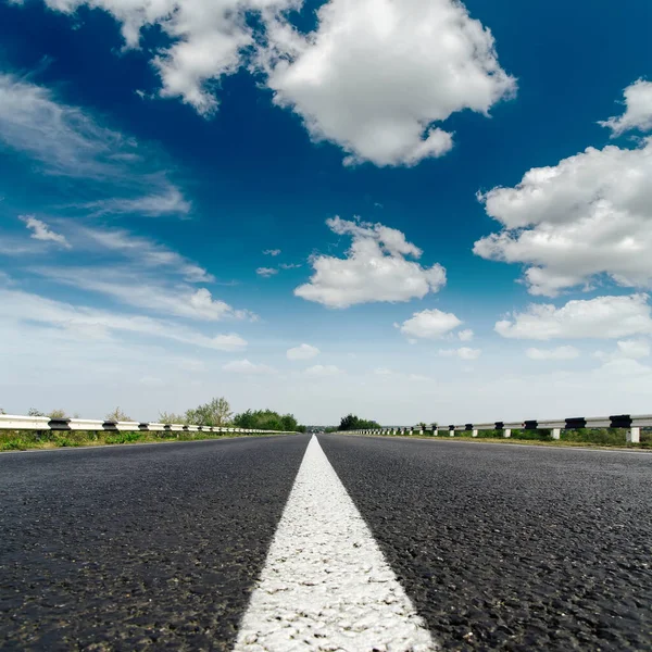 Asphalt Road Closeup White Line Center Low Dramatic Clouds Blue — Stock Photo, Image