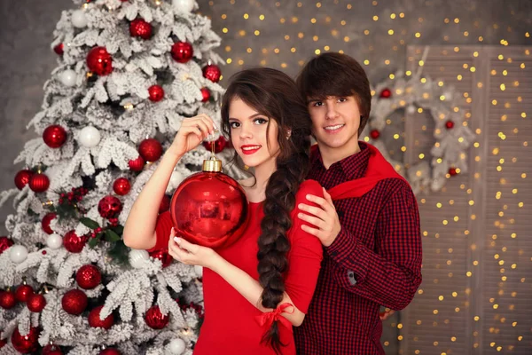 Happy Christmas Couple Embrace Red Clothes Young Brunette Girl Hugging — Stock Photo, Image