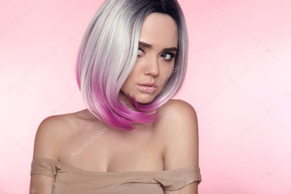 Ombre bob short hairstyle. Beautiful hair coloring woman. Trendy puprle haircut. Blond model with short shiny haircuts isolated on pink Background. Makeup. Beauty Salon.