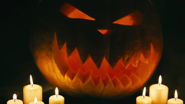 Helloween pumpkin with candles — Stock Video