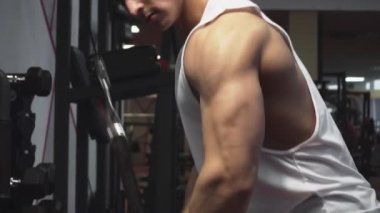 Triceps workout in gym machine