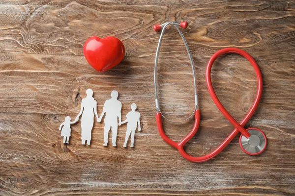 Family Figure Red Heart Stethoscope Wooden Background Health Care Concept — Stock Photo, Image