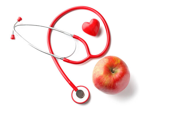 Stethoscope with apple on white background. Health care concept