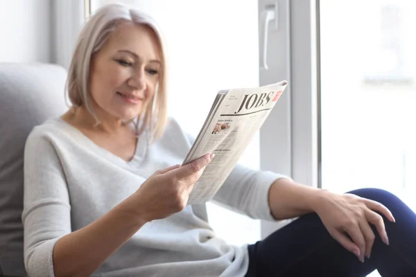 Mature Woman Reading Newspaper Home — Stock Photo, Image
