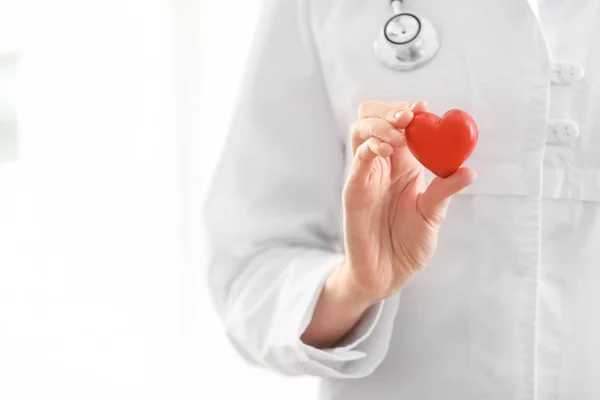 Female Doctor Red Heart Blurred Background — Stock Photo, Image