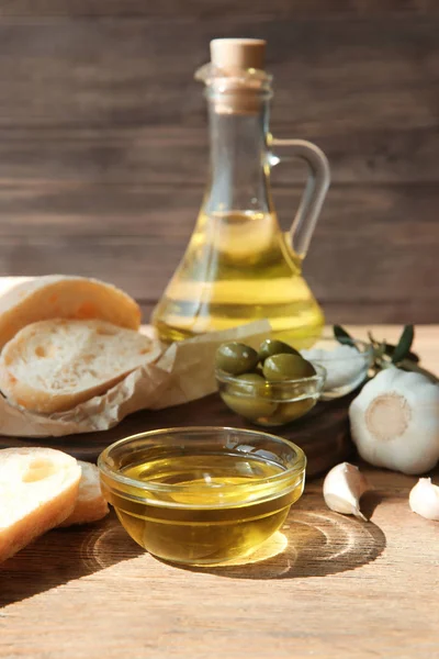 Bottle Olive Oil Fresh Bread Garlic Wooden Table — Stock Photo, Image