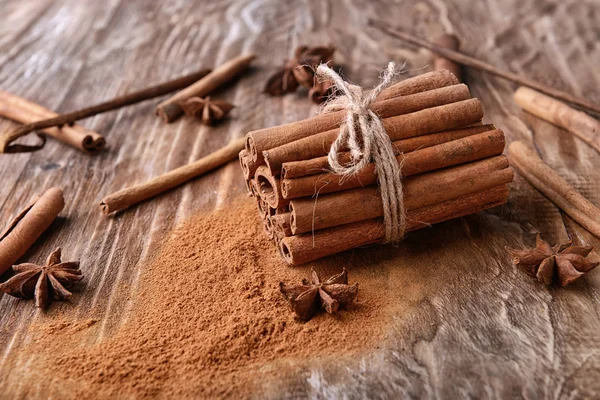 Tied Cinnamon Sticks Powder Wooden Background — Stock Photo, Image