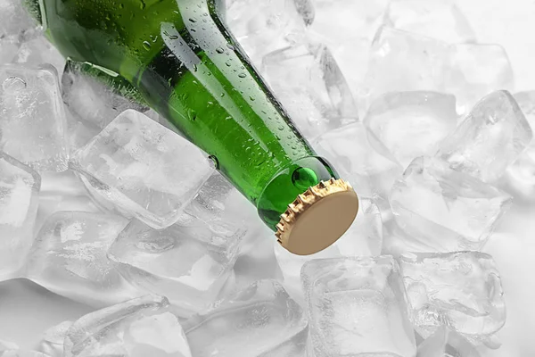 Bottle of beer in ice, closeup