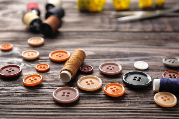 Different Buttons Threads Wooden Background — Stock Photo, Image