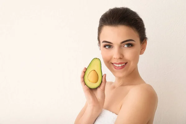 Beautiful Young Woman Avocado Light Background — Stock Photo, Image