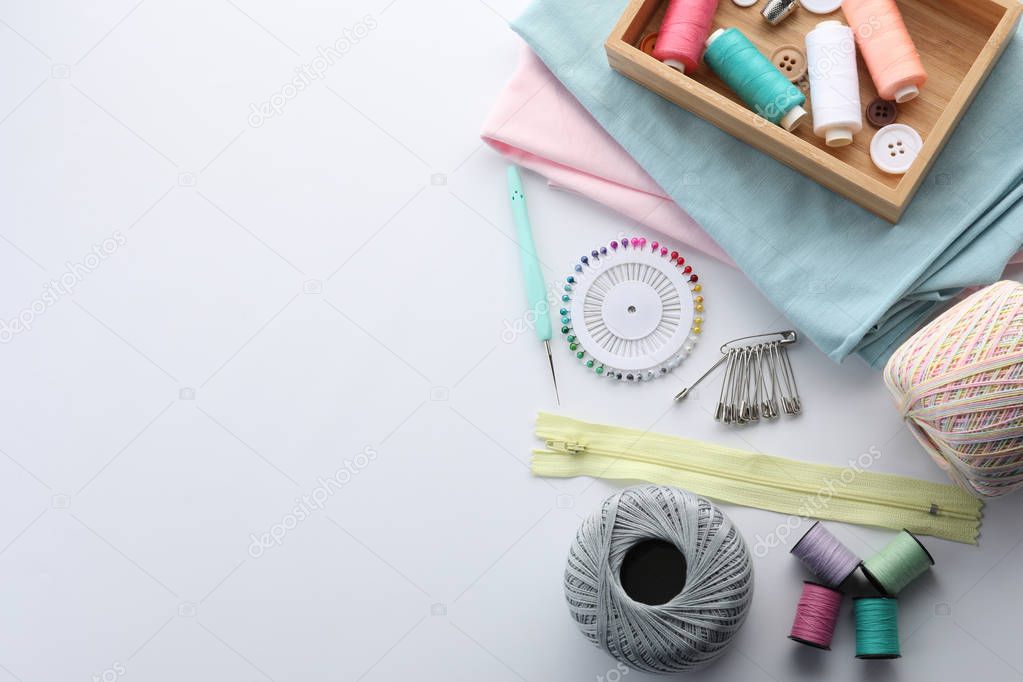Set of sewing accessories on white background