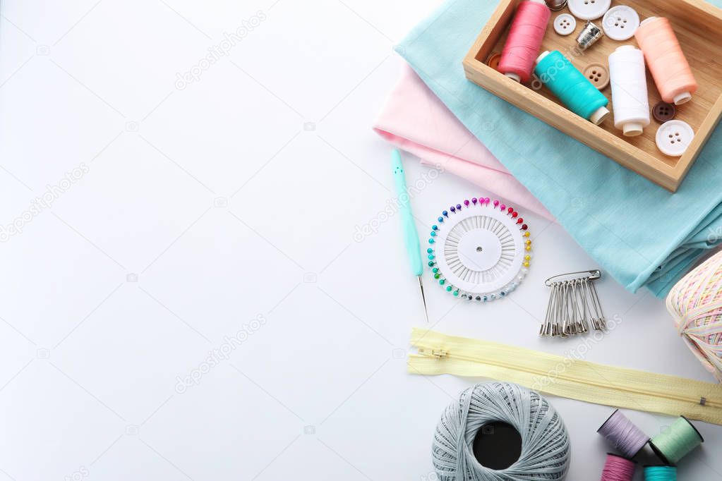 Set of sewing accessories on white background