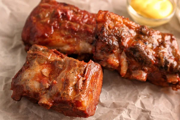 Delicious Grilled Ribs Parchment Closeup — Stock Photo, Image