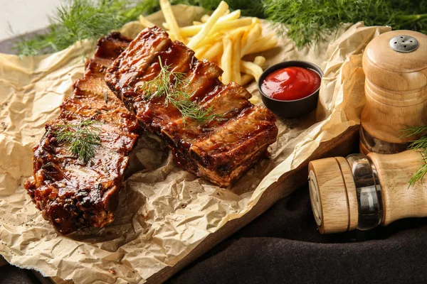Delicious Grilled Ribs Sauce French Fries Parchment — Stock Photo, Image