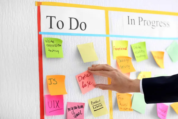 Man Attaching Sticky Note Scrum Task Board Office — Stock Photo, Image