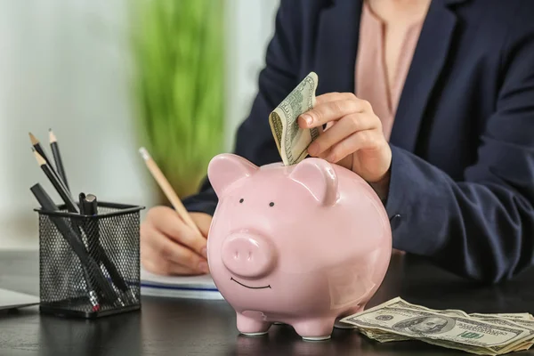 Woman Putting Money Piggy Bank Savings Concept — Stock Photo, Image