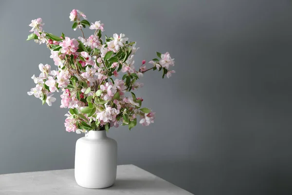 Vase Beautiful Blossoming Branches Table Grey Background — Stock Photo, Image