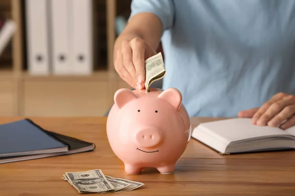 Man Putting Money Piggy Bank Savings Concept — Stock Photo, Image