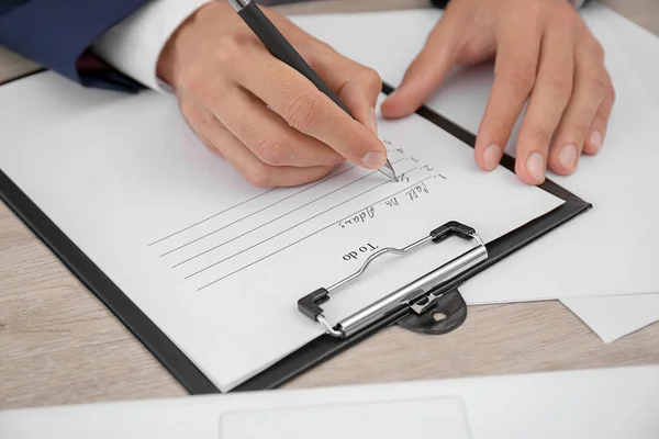 Man Making List While Sitting Table Closeup — Stock Photo, Image