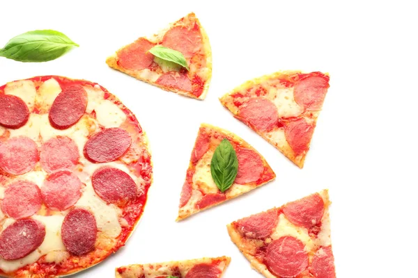 Tasty pepperoni pizza with pieces on white background