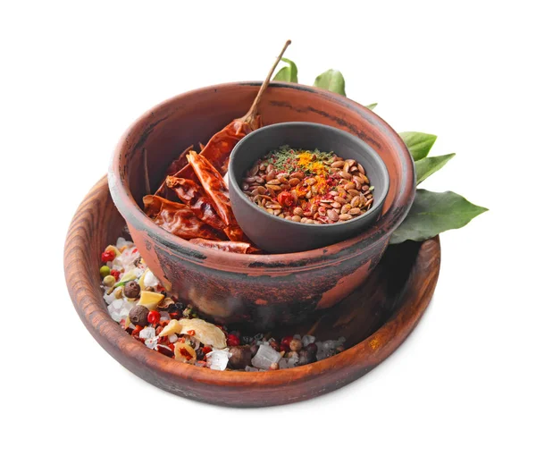 Bowls with different spices on white background