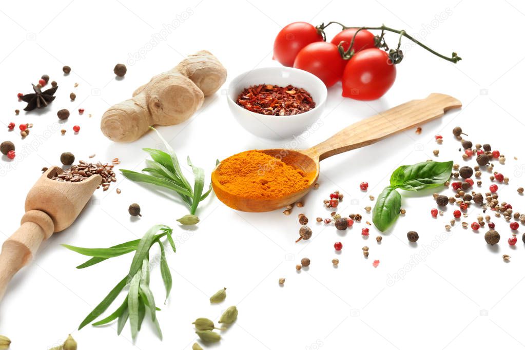 Fresh tomatoes and variety of spices on white background