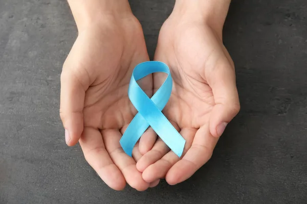 Male Hands Holding Blue Ribbon Grey Background Prostate Cancer Concept — Stock Photo, Image