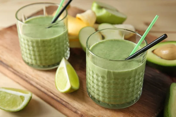 Glasses Tasty Avocado Smoothie Ingredients Wooden Board — Stock Photo, Image