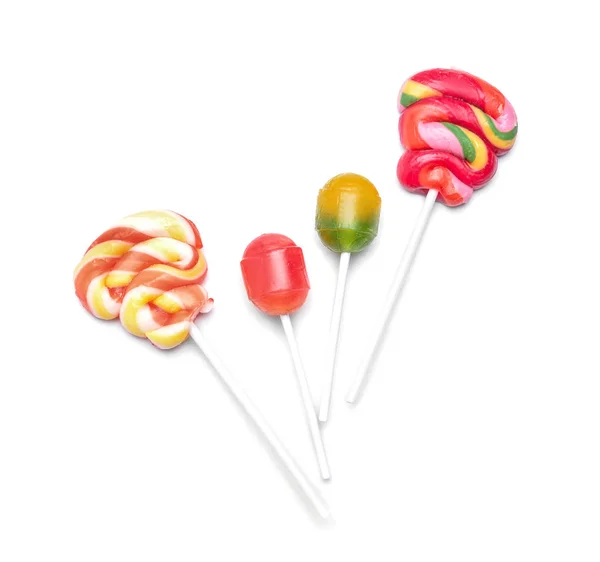 Lollipops Coloridos Saborosos Fundo Branco Leigos Planos — Fotografia de Stock