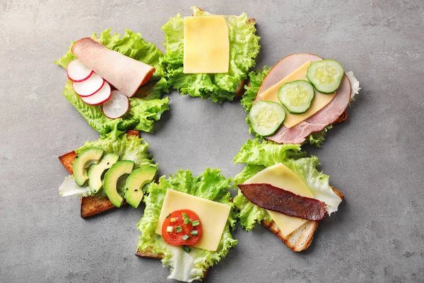 Stock image Different delicious toasts on table