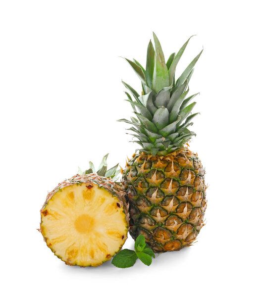 Delicious pineapples on white background