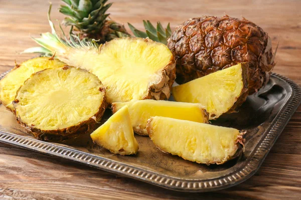 Tray Delicious Pineapples Wooden Background — Stock Photo, Image