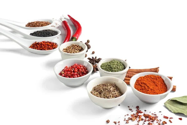 Composition with various spices on white background