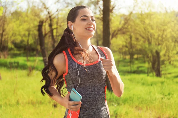 Sporty Young Woman Listening Music While Running Park — Stock Photo, Image