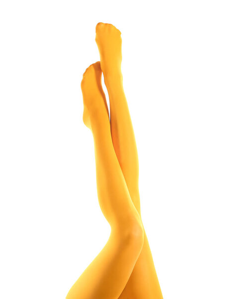 Legs of beautiful young woman in tights on white background