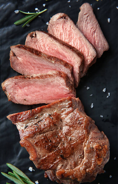 Tasty grilled steak on plate, closeup